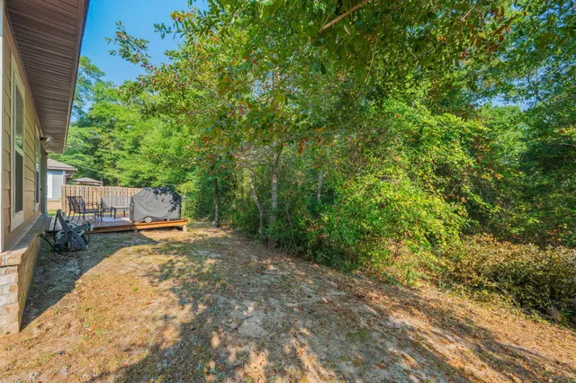 a view of a backyard with sitting area