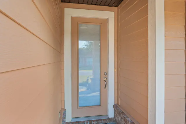 view of a bathroom from a glass door