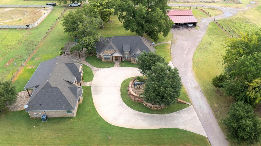 777 Stiles Road Whitesboro, TX 76273 - Photo 4 of 37 an aerial view of a house with swimming pool outdoor seating and yard