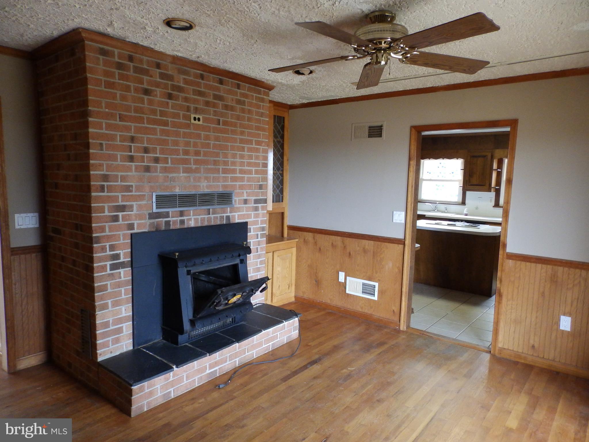 3395 Weldon Road New Windsor, MD 21776 - Photo 12 of 34 a living room with furniture and a fireplace