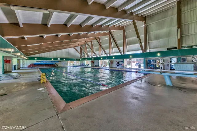 a view of swimming pool with a patio