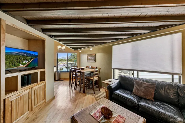 a reading room with furniture and wooden floor