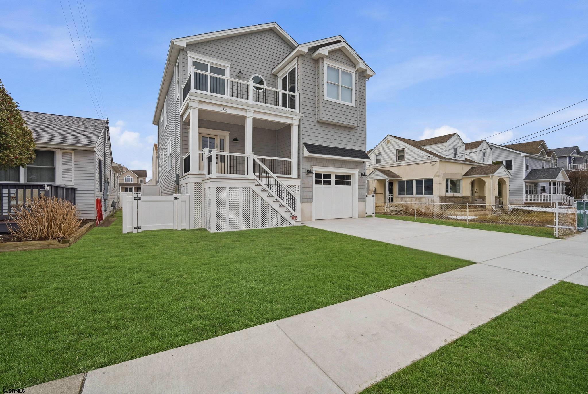 a view of house with yard and front view of a house