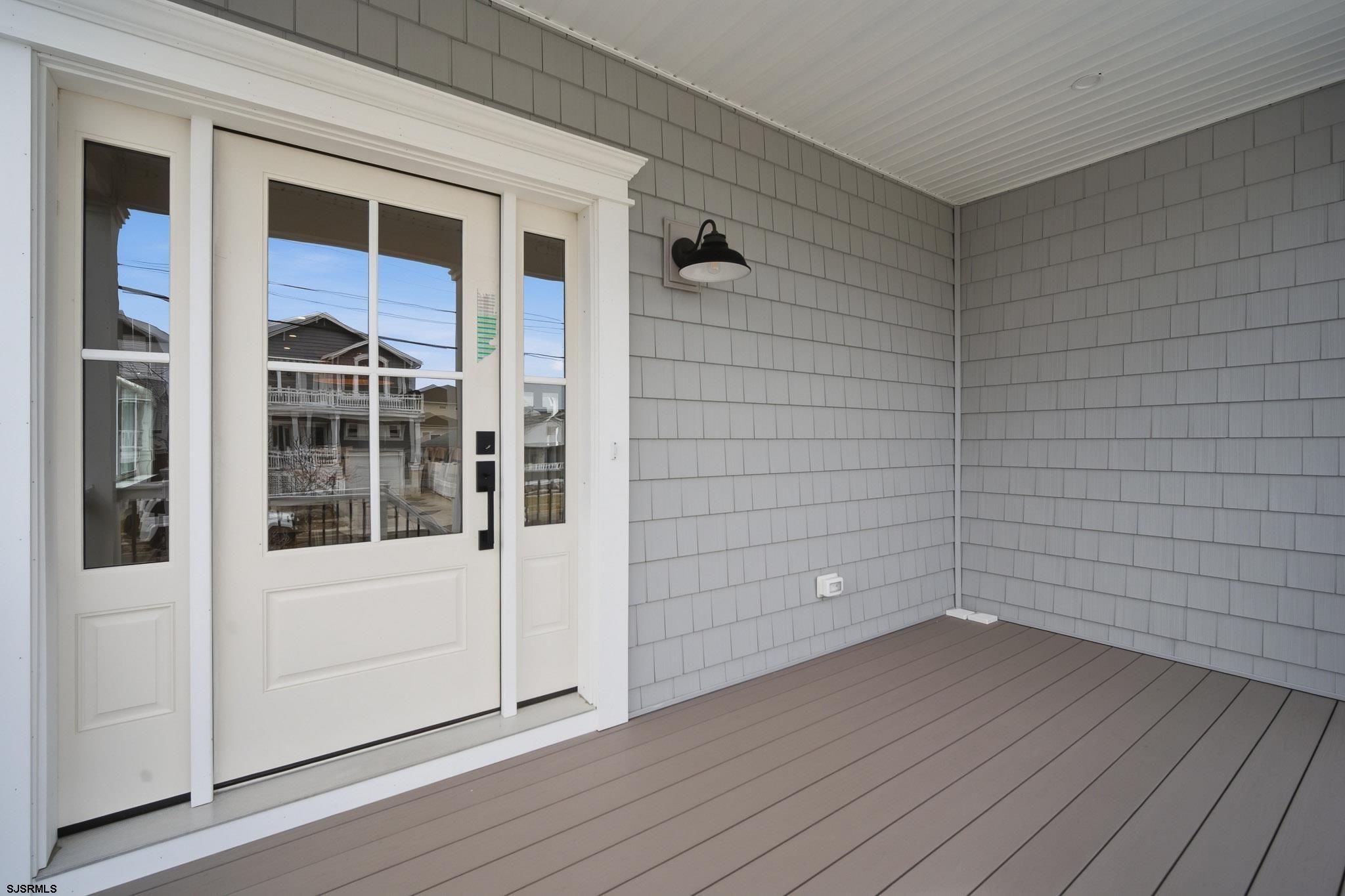 150 South 9th Brigantine, NJ 08203 - Photo 2 of 32 a view of empty room with wooden floor and windows