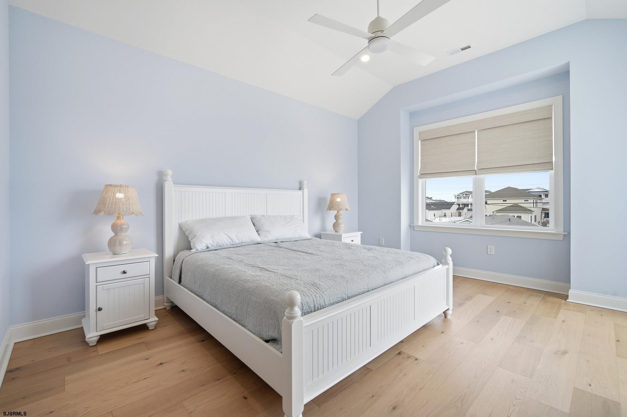 150 South 9th Brigantine, NJ 08203 - Photo 23 of 32 a spacious bedroom with a bed and a window