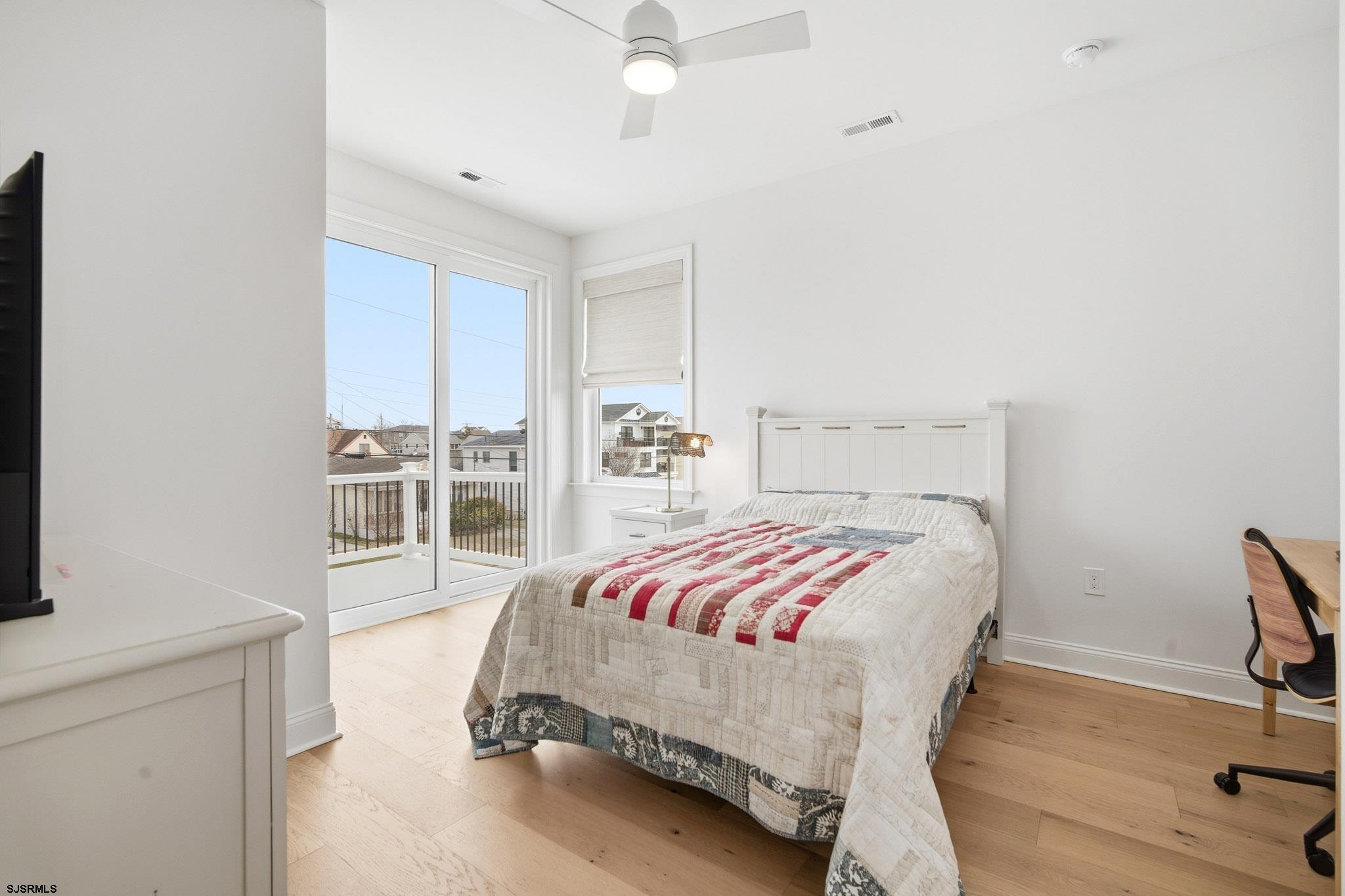 150 South 9th Brigantine, NJ 08203 - Photo 29 of 32 a bedroom with a bed and a table