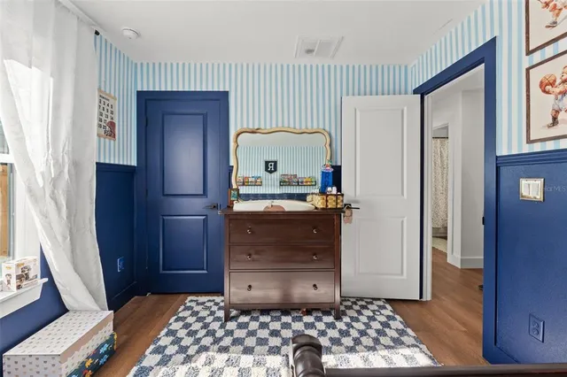 a bedroom with a bed and a cabinets