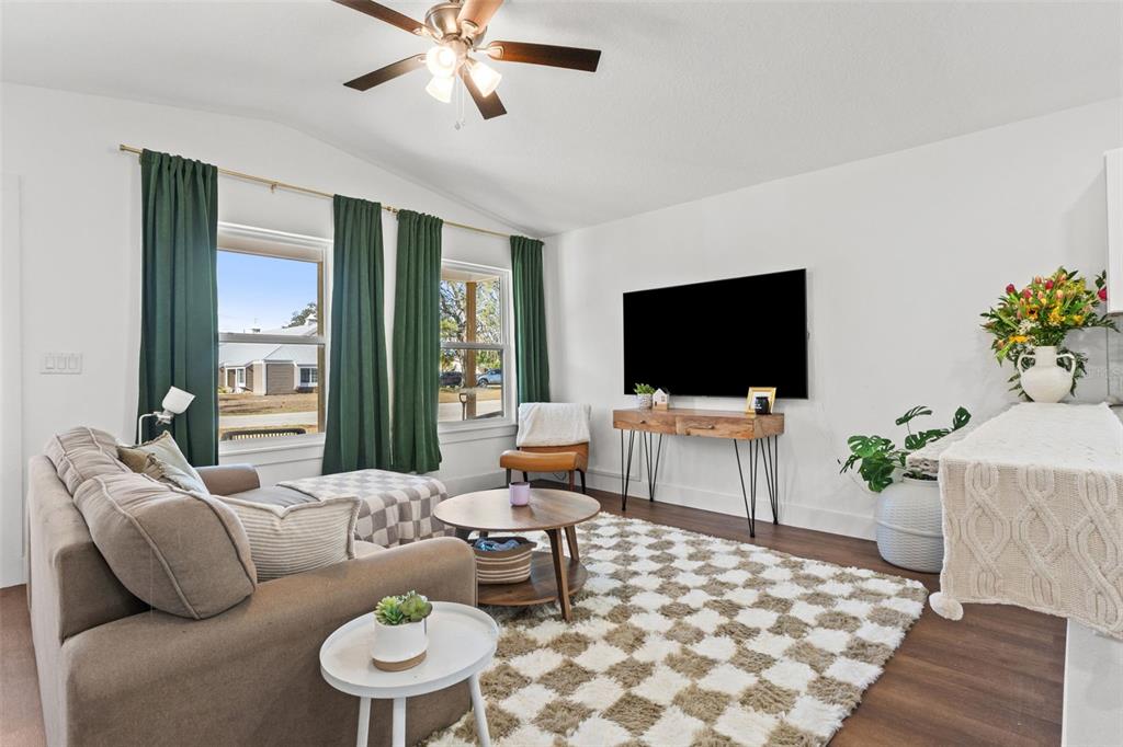 3592 Arrowhead Avenue Spring Hill, FL 34606 - Photo 2 of 22 a living room with furniture and a flat screen tv