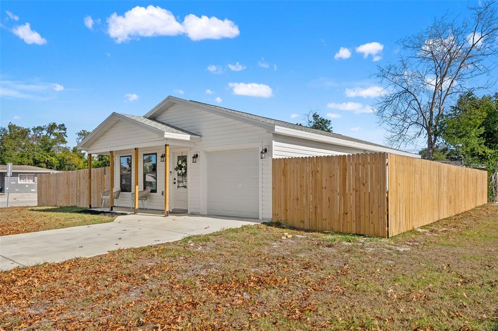 3592 Arrowhead Avenue Spring Hill, FL 34606 - Photo 4 of 22 a view of a house with a backyard