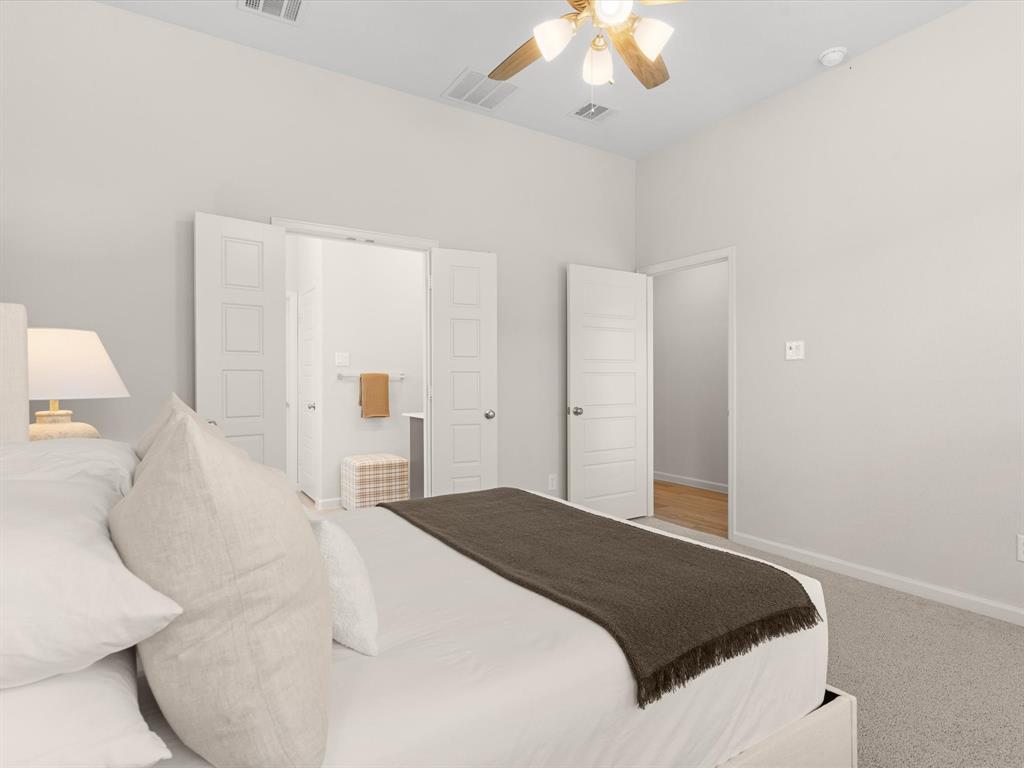 166 Palo Duro Bend Rhome, TX 76078 - Photo 20 of 40 Private primary suite with spacious layout and large windows.