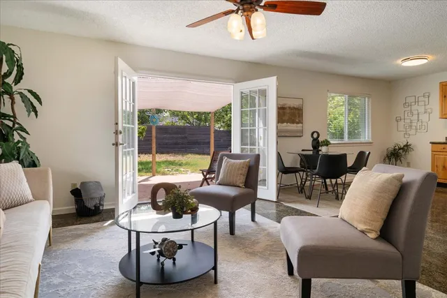 a living room with furniture and a large window