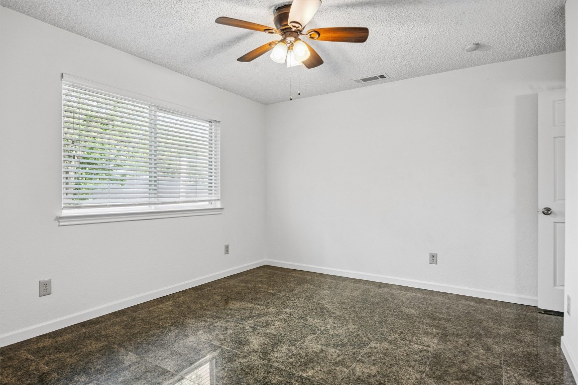 6308 Shadow Bend Austin, TX 78745 - Photo 16 of 35 a view of a room with a ceiling fan and window