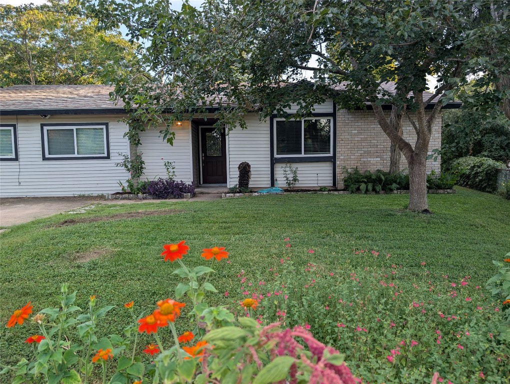 6308 Shadow Bend Austin, TX 78745 - Photo 24 of 35 a front view of house with yard and outdoor seating