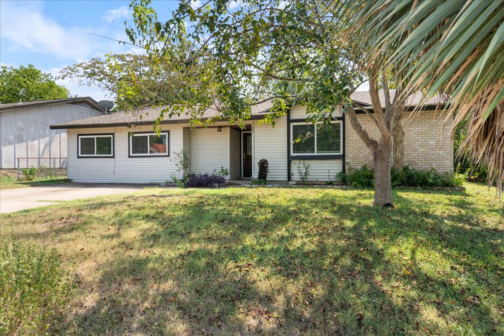 6308 Shadow Bend Austin, TX 78745 - Photo 25 of 35 a front view of house with yard and trees
