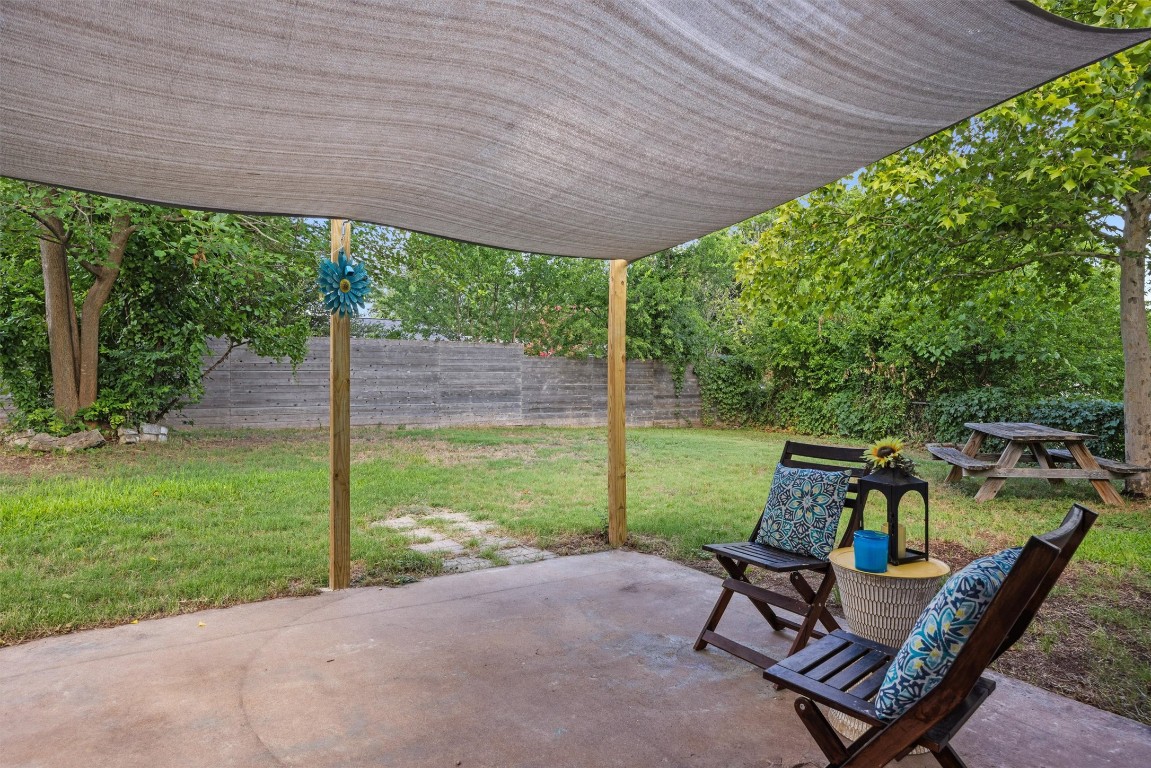 6308 Shadow Bend Austin, TX 78745 - Photo 26 of 35 a backyard of a house with table and chairs
