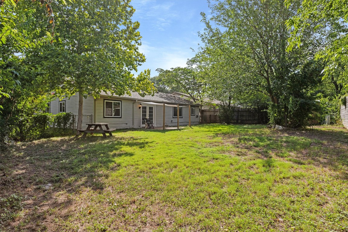 6308 Shadow Bend Austin, TX 78745 - Photo 30 of 35 a front view of house with yard and green space