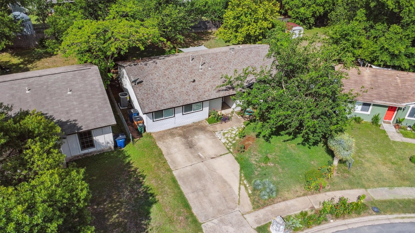6308 Shadow Bend Austin, TX 78745 - Photo 33 of 35 an aerial view of a house with a garden and large trees