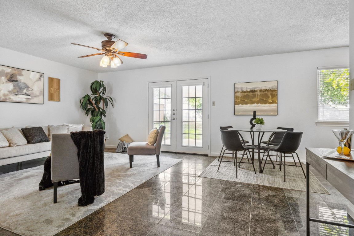 6308 Shadow Bend Austin, TX 78745 - Photo 5 of 35 a living room with furniture a chandelier and a window
