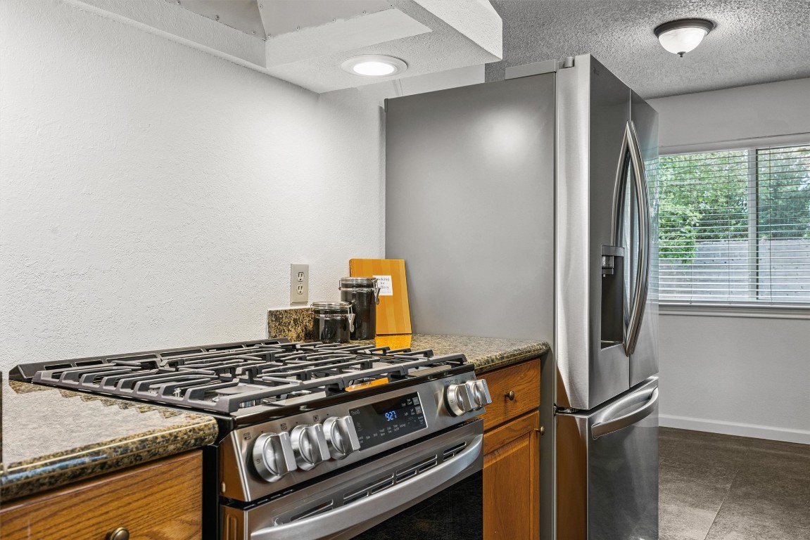 6308 Shadow Bend Austin, TX 78745 - Photo 8 of 35 a stove top oven sitting inside of a kitchen