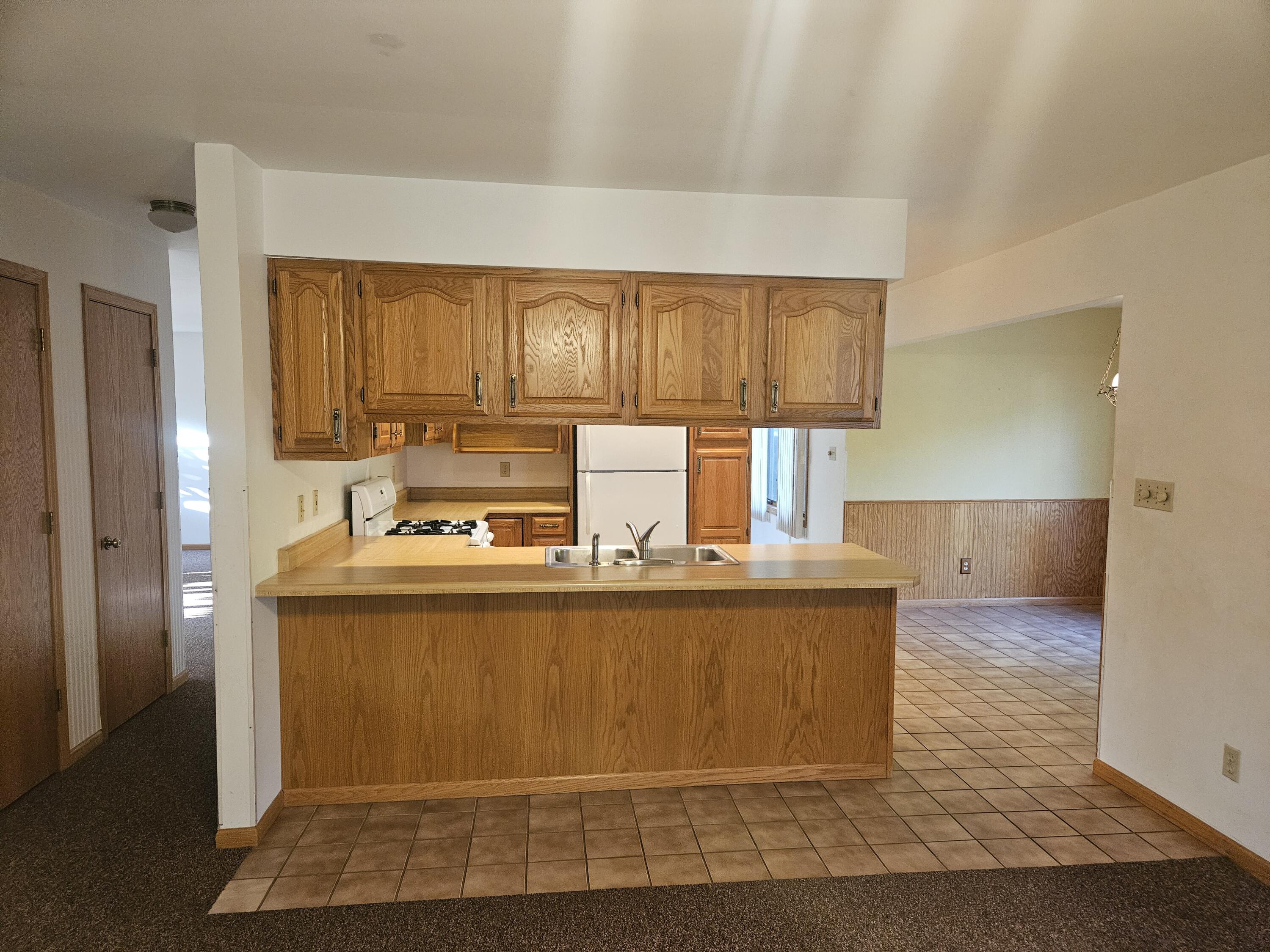 680 Meadow Lane Crown Point, IN 46307 - Photo 11 of 46 a kitchen with a sink cabinets and window
