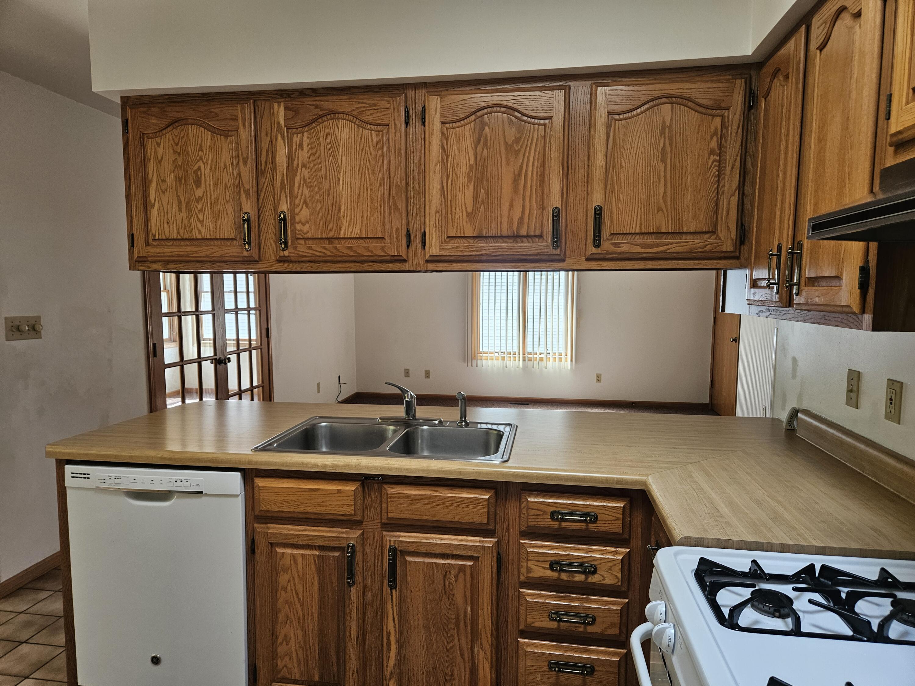 680 Meadow Lane Crown Point, IN 46307 - Photo 14 of 46 a kitchen with stainless steel appliances granite countertop a sink stove and cabinets