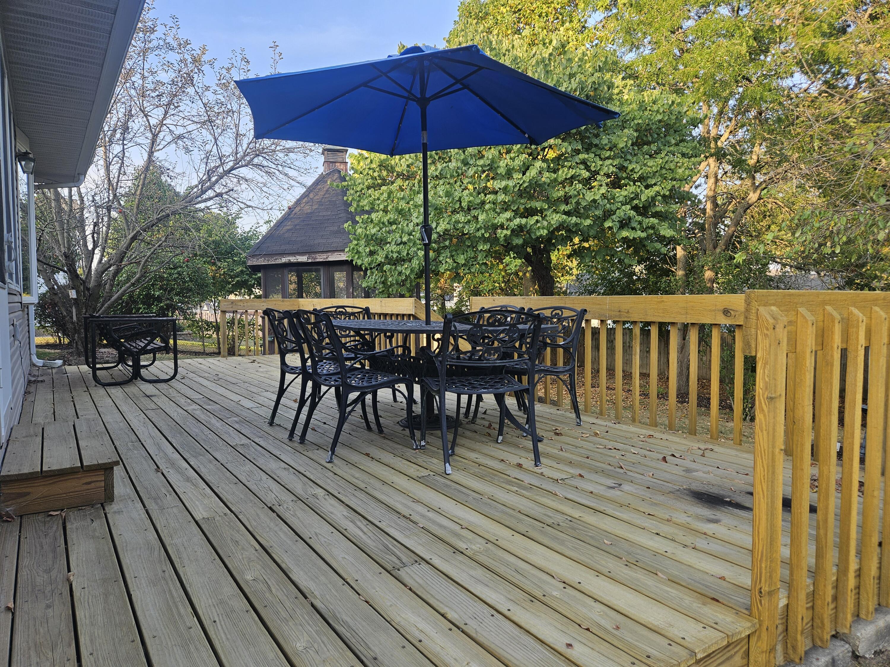 680 Meadow Lane Crown Point, IN 46307 - Photo 2 of 46 a view of a wooden deck with furniture