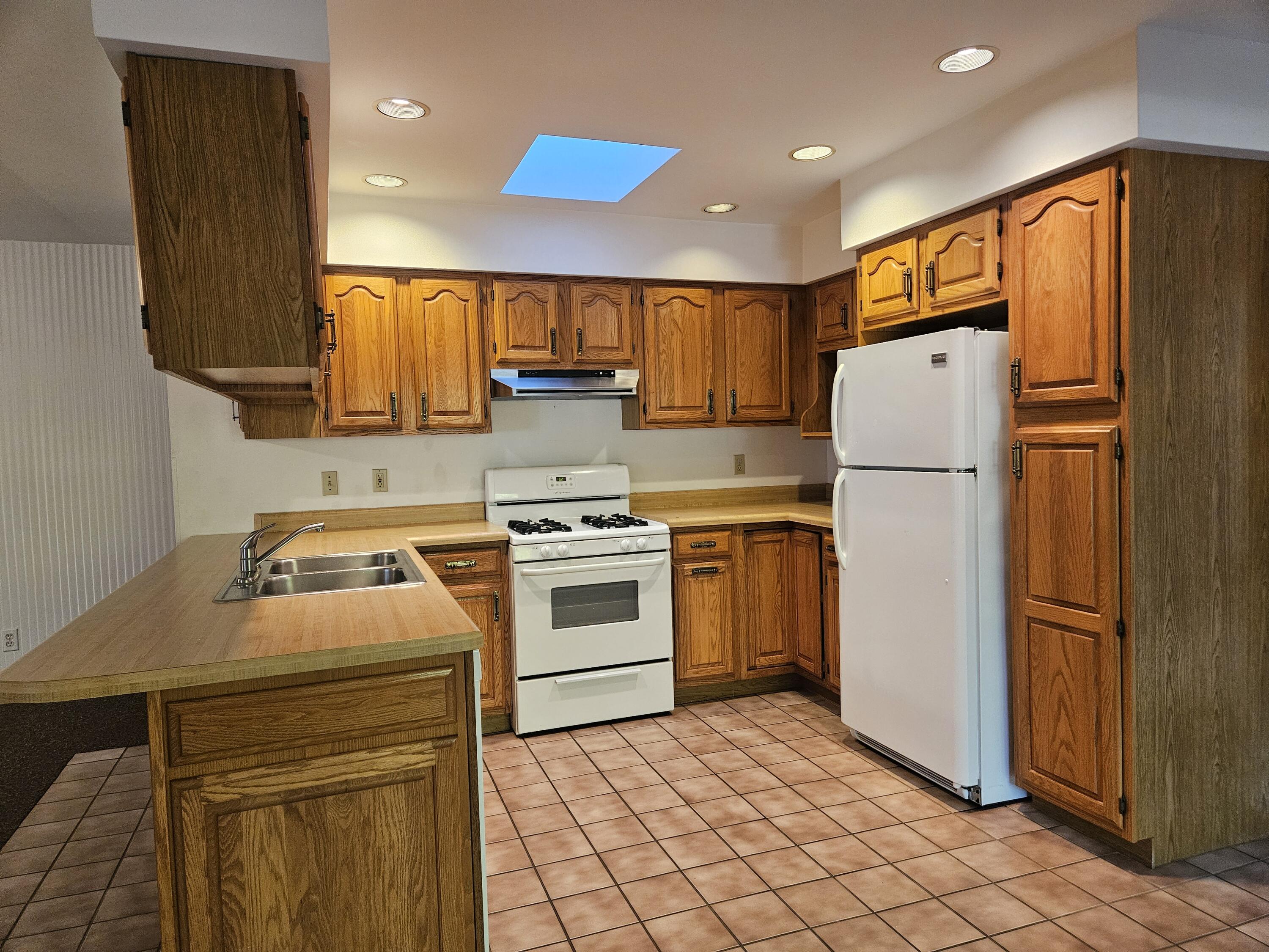 680 Meadow Lane Crown Point, IN 46307 - Photo 3 of 46 a kitchen with a white stove top oven and refrigerator