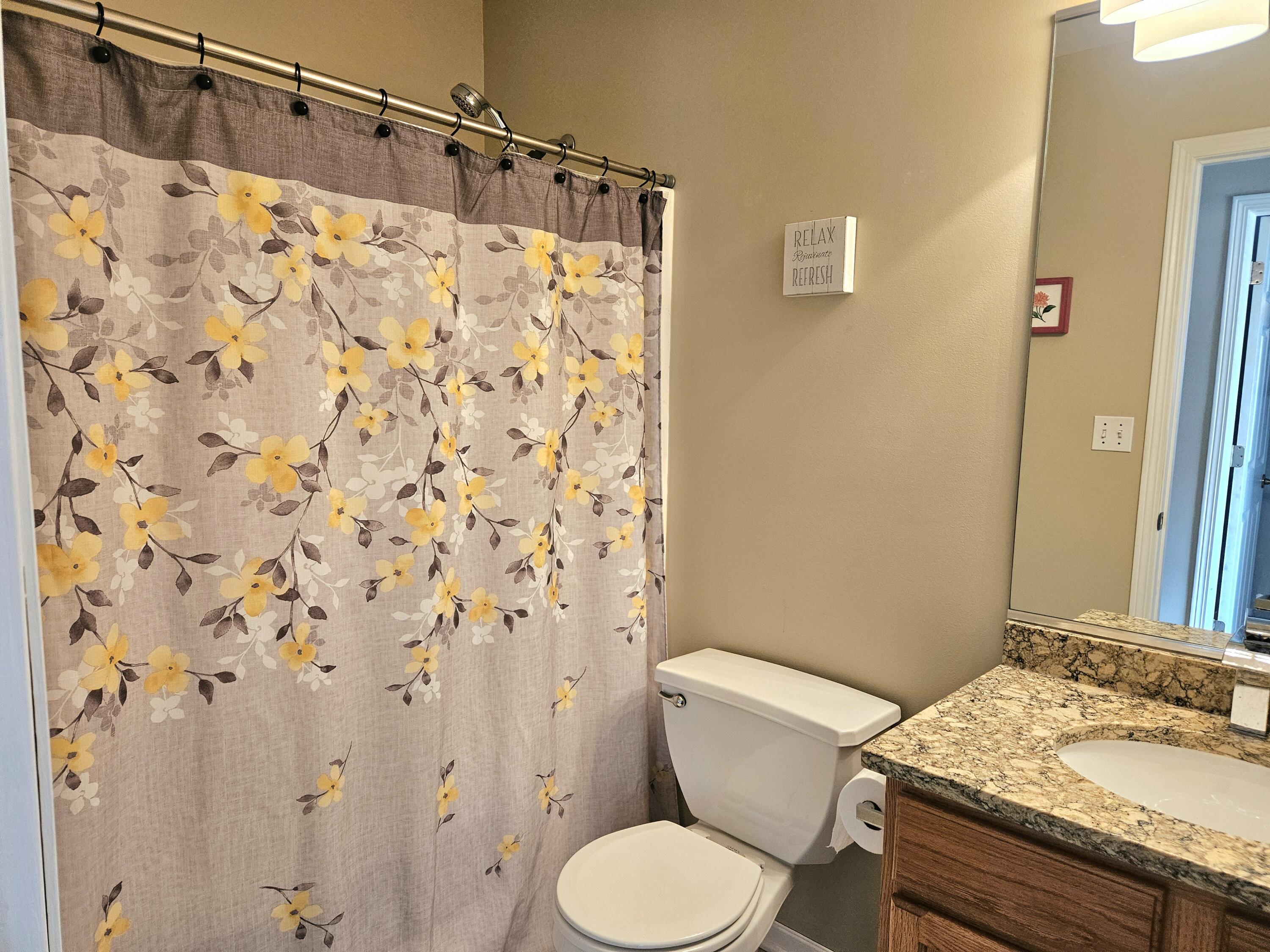 680 Meadow Lane Crown Point, IN 46307 - Photo 31 of 46 a white toilet sitting next to a bathroom sink