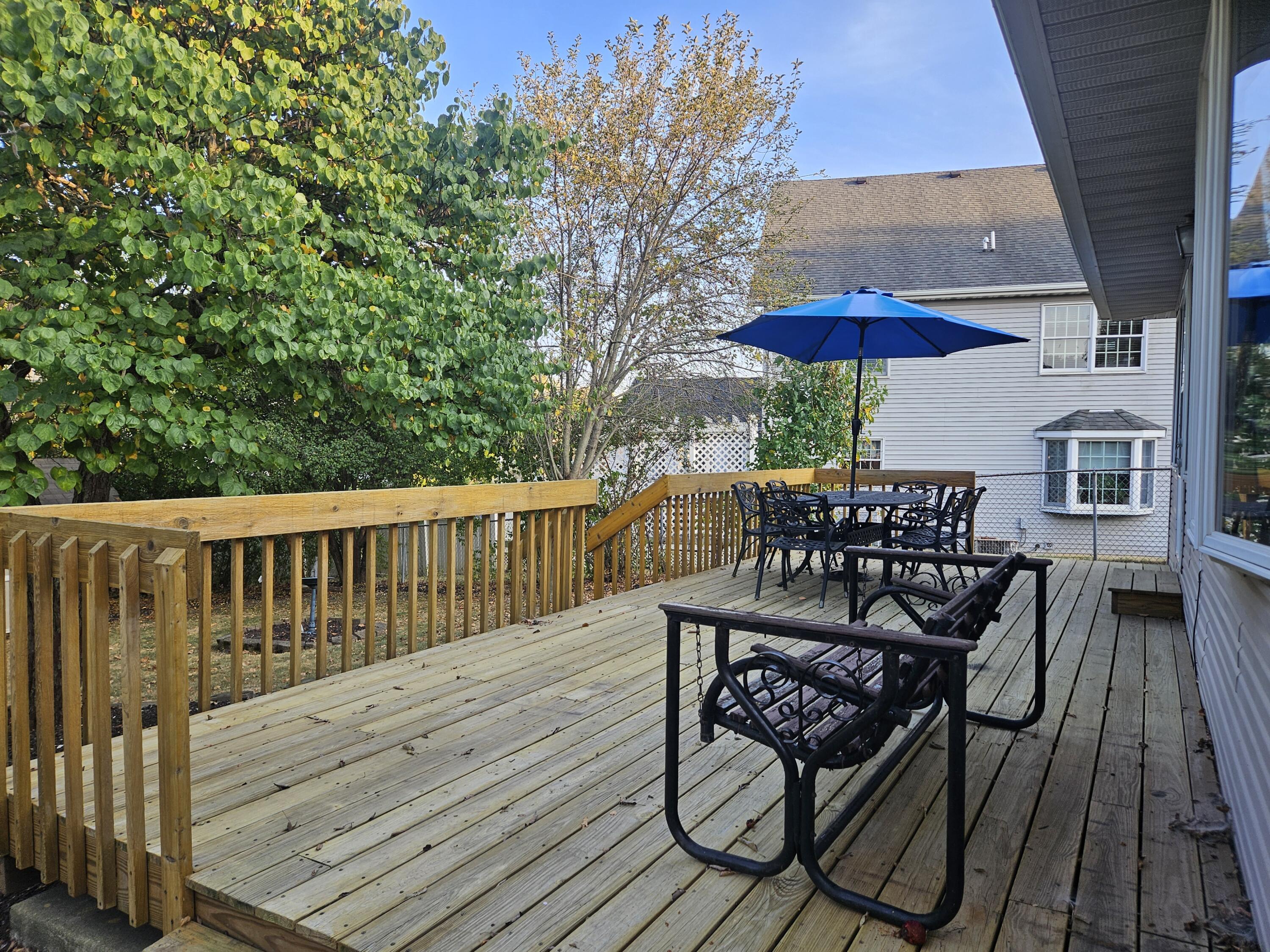680 Meadow Lane Crown Point, IN 46307 - Photo 40 of 46 a view of balcony with wooden floor and outdoor seating