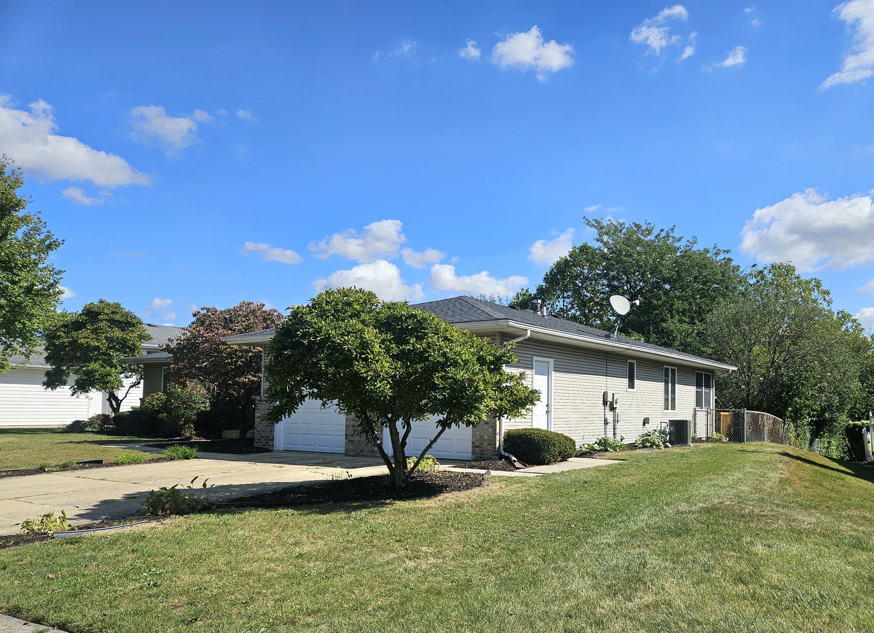 680 Meadow Lane Crown Point, IN 46307 - Photo 44 of 46 a front view of a house with a yard and trees