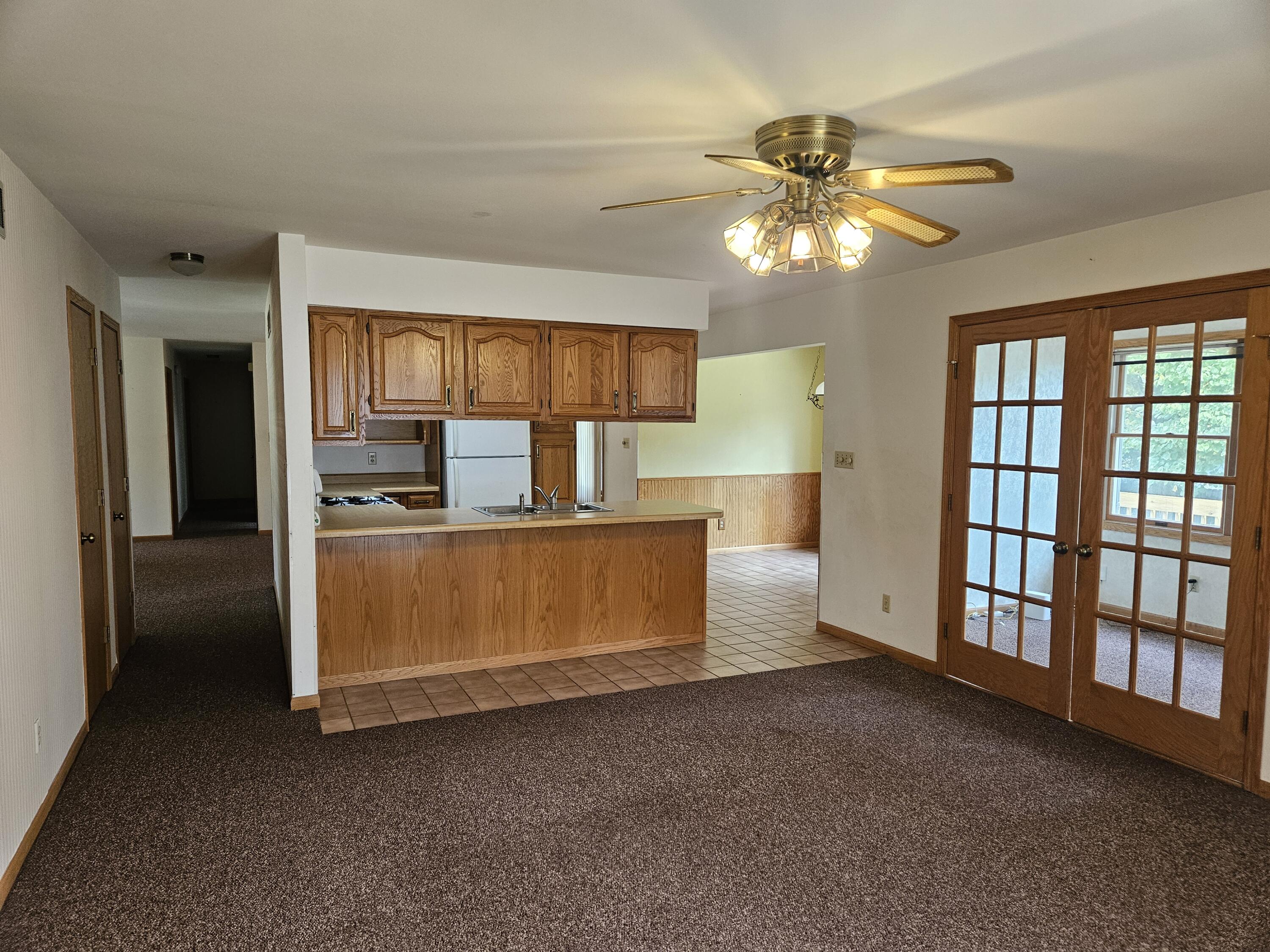 680 Meadow Lane Crown Point, IN 46307 - Photo 5 of 46 a living room with furniture and a chandelier