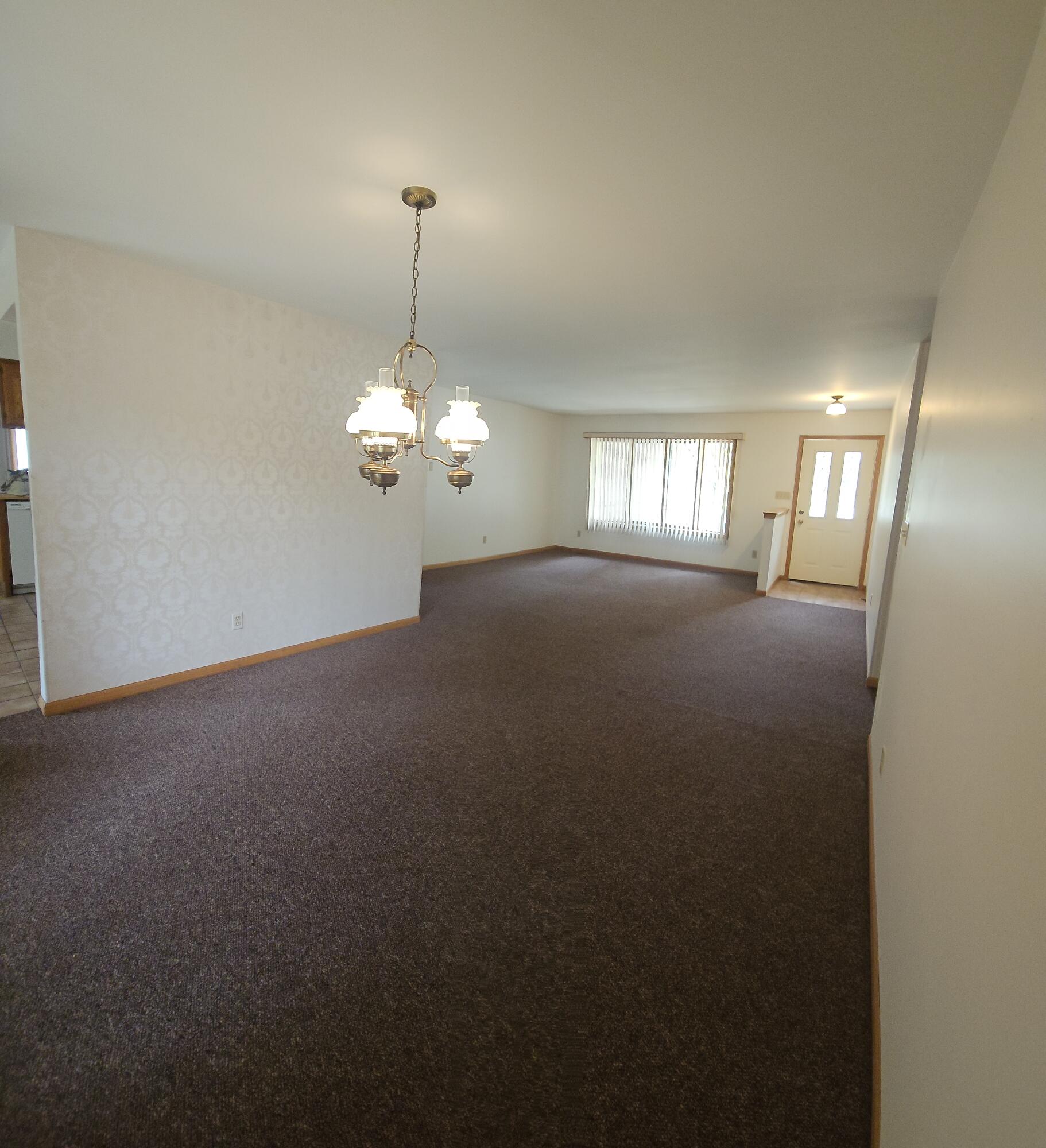 680 Meadow Lane Crown Point, IN 46307 - Photo 6 of 46 a view of a chandelier in big room and chandelier fan