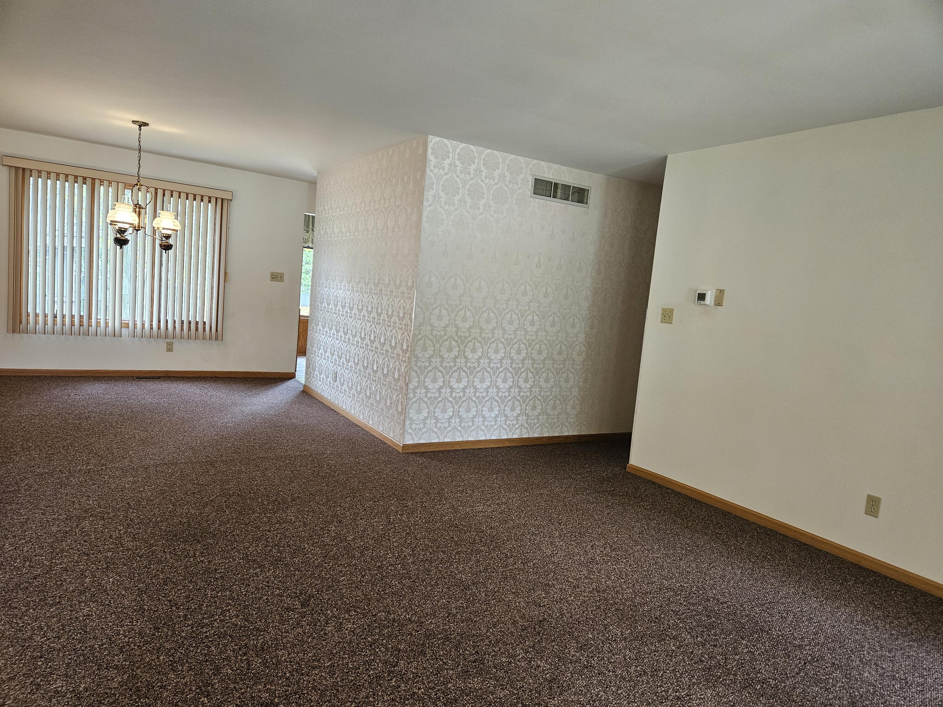 680 Meadow Lane Crown Point, IN 46307 - Photo 7 of 46 an empty room with windows