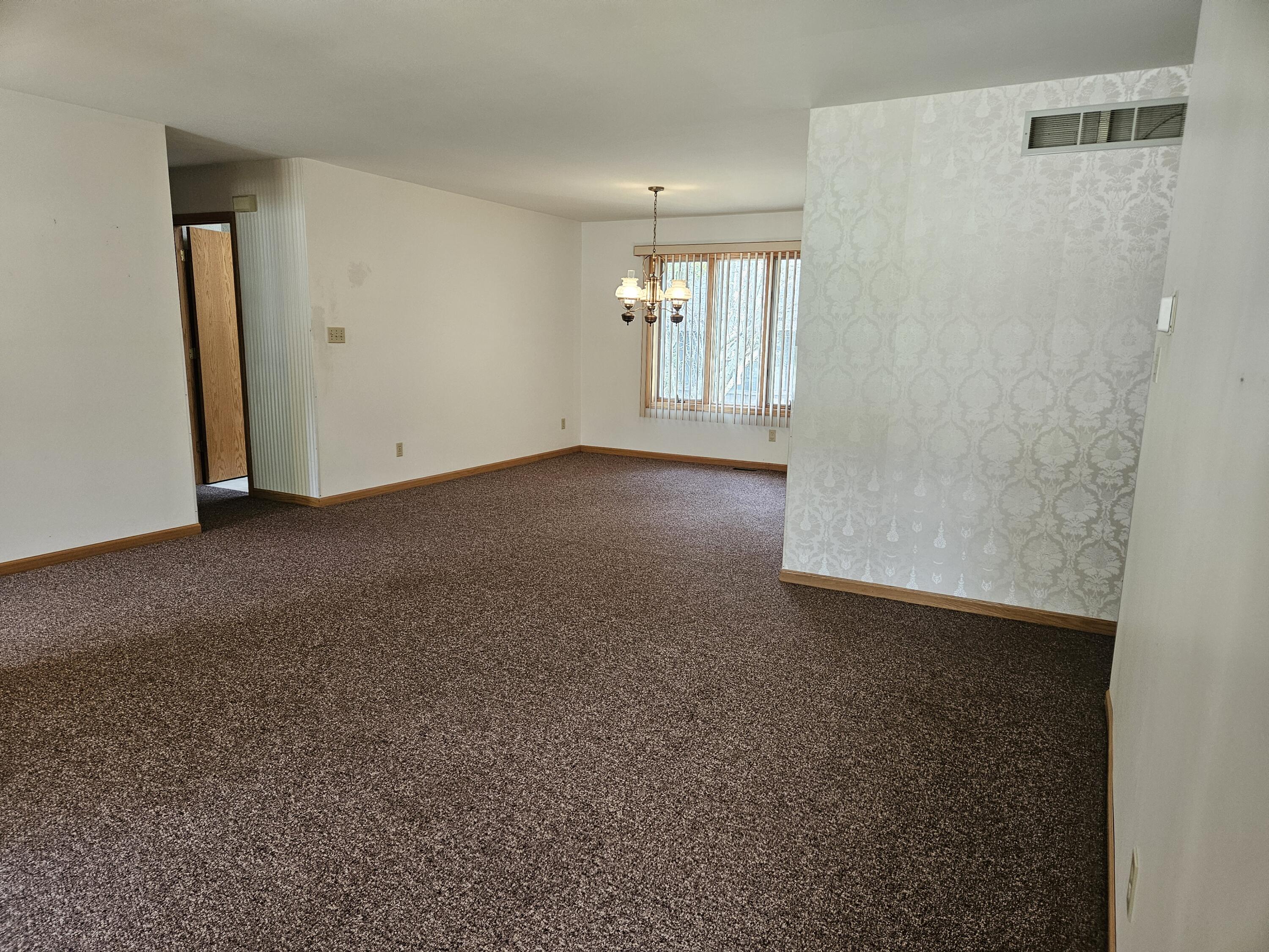 680 Meadow Lane Crown Point, IN 46307 - Photo 8 of 46 a view of an empty room with a window