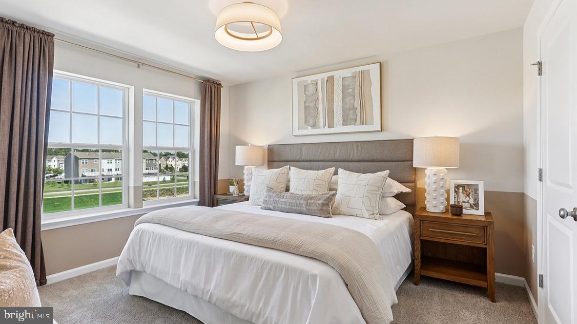 22 Baybreeze Drive Waretown, NJ 08758 - Photo 18 of 29 a bedroom with a large bed and a window