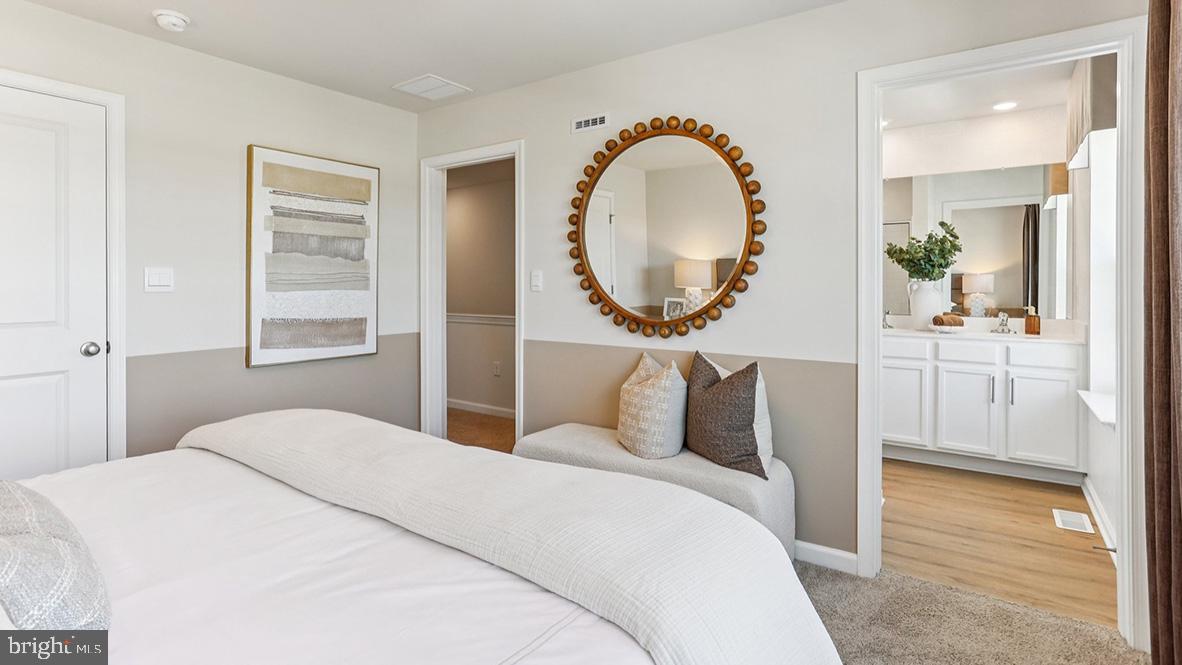 22 Baybreeze Drive Waretown, NJ 08758 - Photo 20 of 29 a bedroom with a bed and a mirror