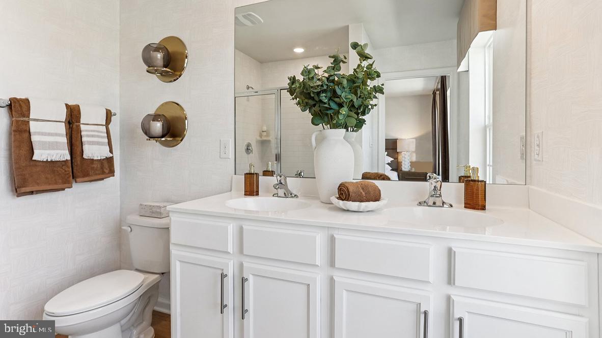 22 Baybreeze Drive Waretown, NJ 08758 - Photo 21 of 29 a bathroom with a granite countertop sink a toilet mirror and vanity
