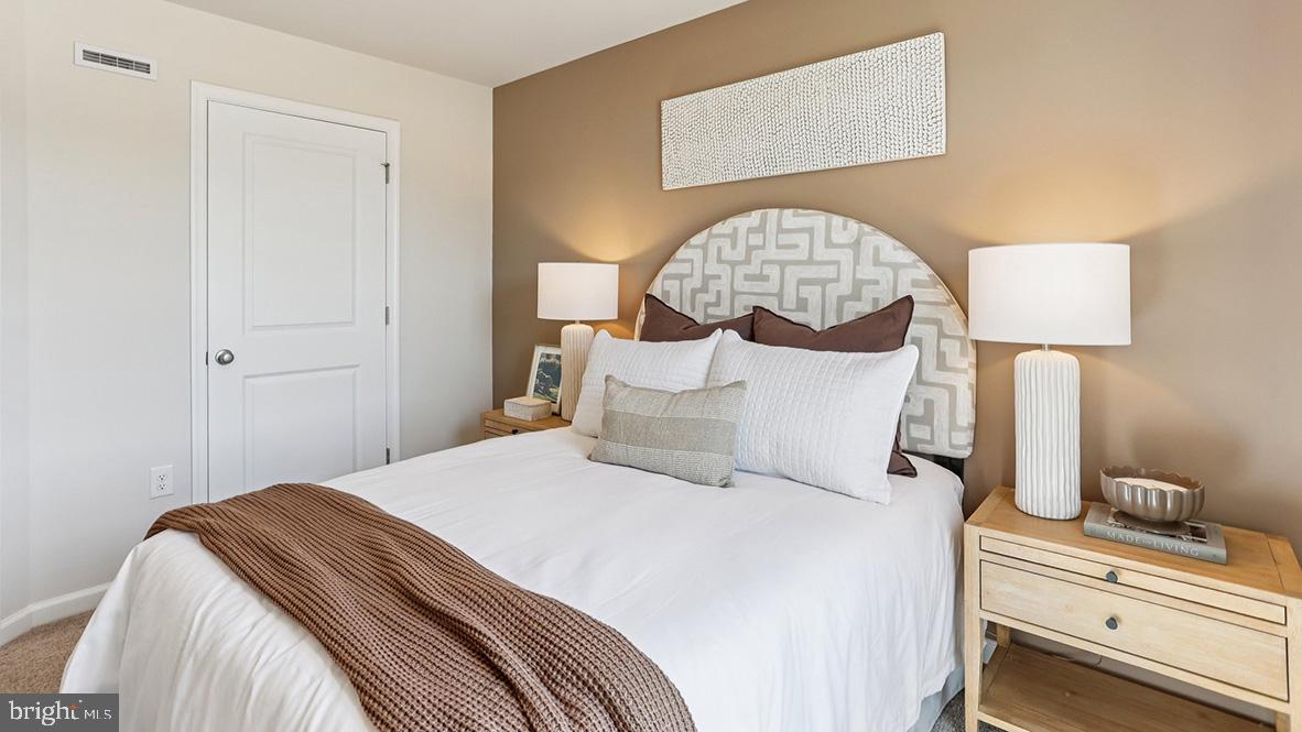 22 Baybreeze Drive Waretown, NJ 08758 - Photo 26 of 29 a bedroom with a bed and a lamp on table