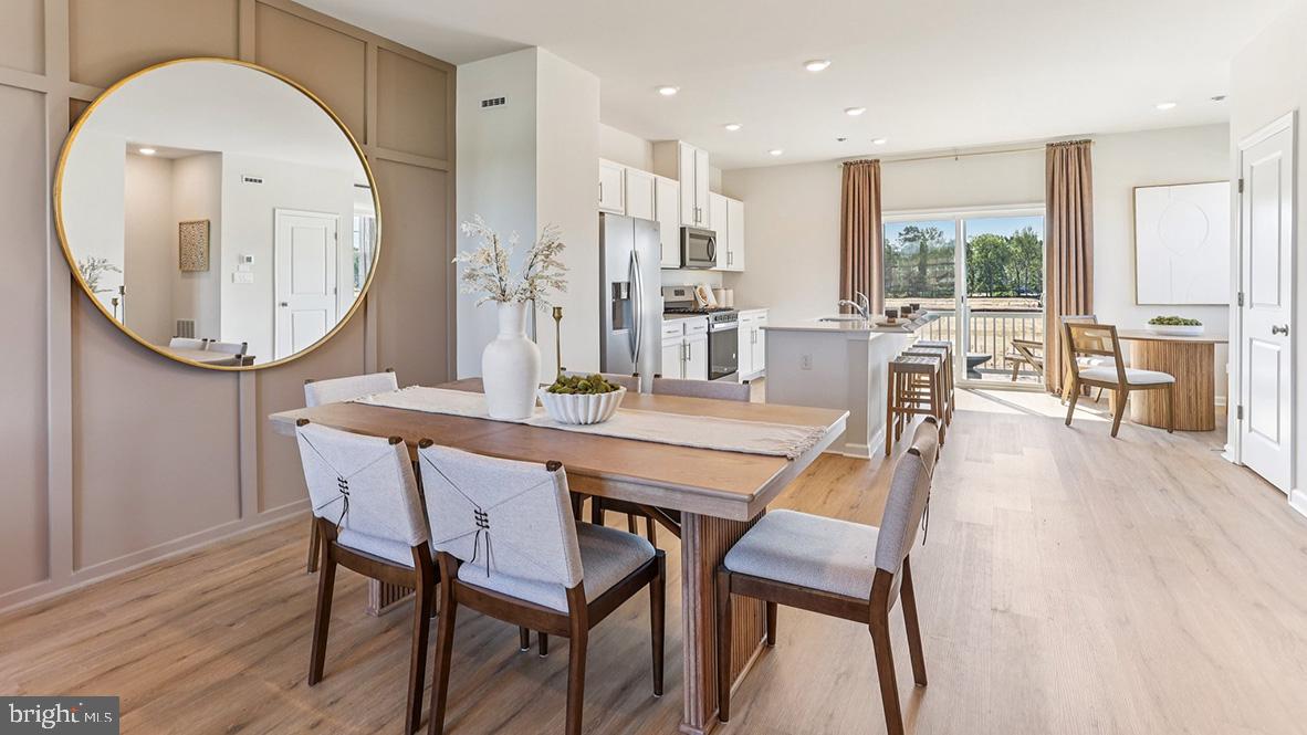 22 Baybreeze Drive Waretown, NJ 08758 - Photo 10 of 29 a dining room with furniture a window and wooden floor