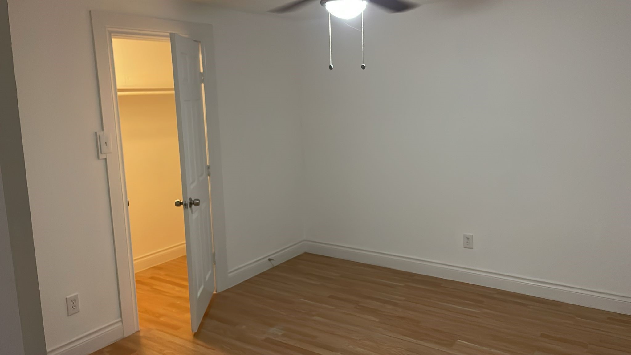 3518 Schurmier Road, Unit A Houston, TX 77047 - Photo 11 of 12 a view of an empty room with wooden floor and a window