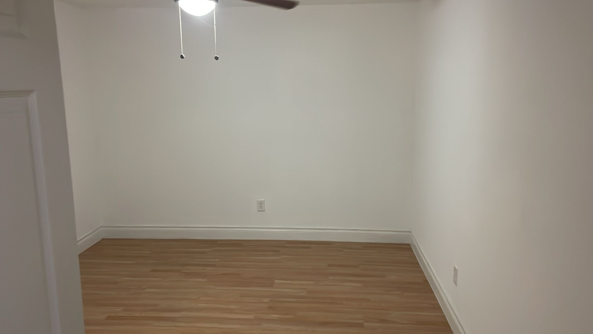 3518 Schurmier Road, Unit A Houston, TX 77047 - Photo 6 of 12 a view of an empty room with wooden floor