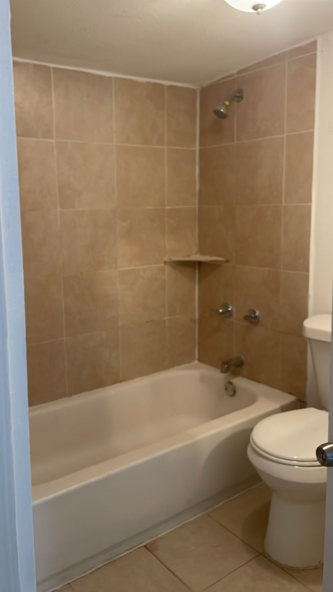 3518 Schurmier Road, Unit A Houston, TX 77047 - Photo 10 of 12 a bathroom with a bathtub and a toilet
