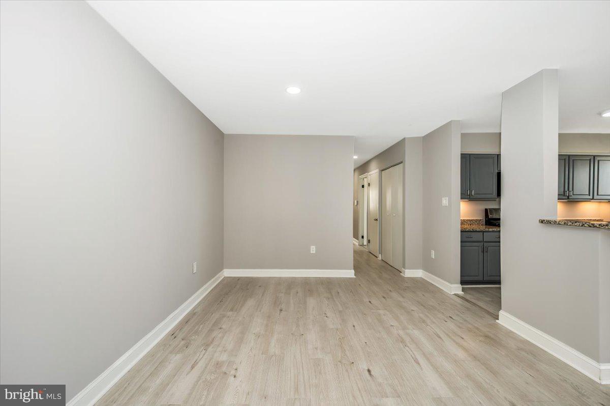 11368 Cherry Hill Road, Unit 1Q204 Beltsville, MD 20705 - Photo 16 of 46 a view of wooden floor in an empty room