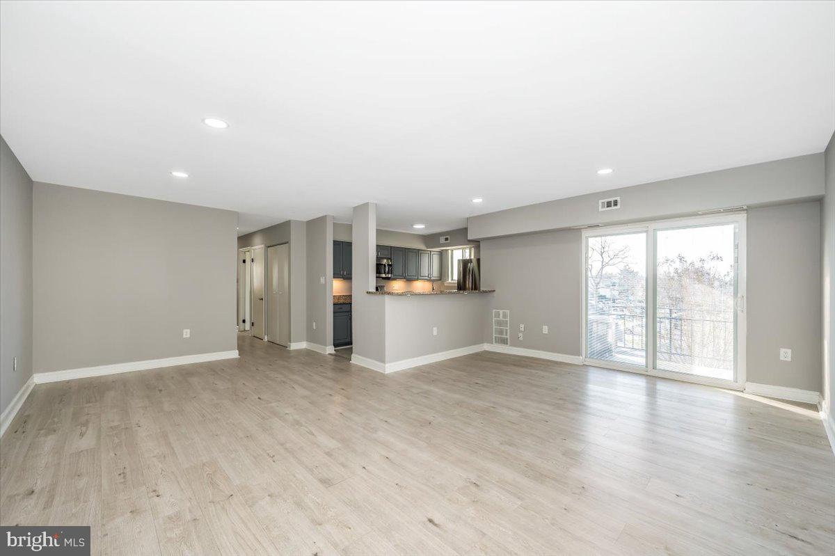 11368 Cherry Hill Road, Unit 1Q204 Beltsville, MD 20705 - Photo 17 of 46 a view of an empty room with a window