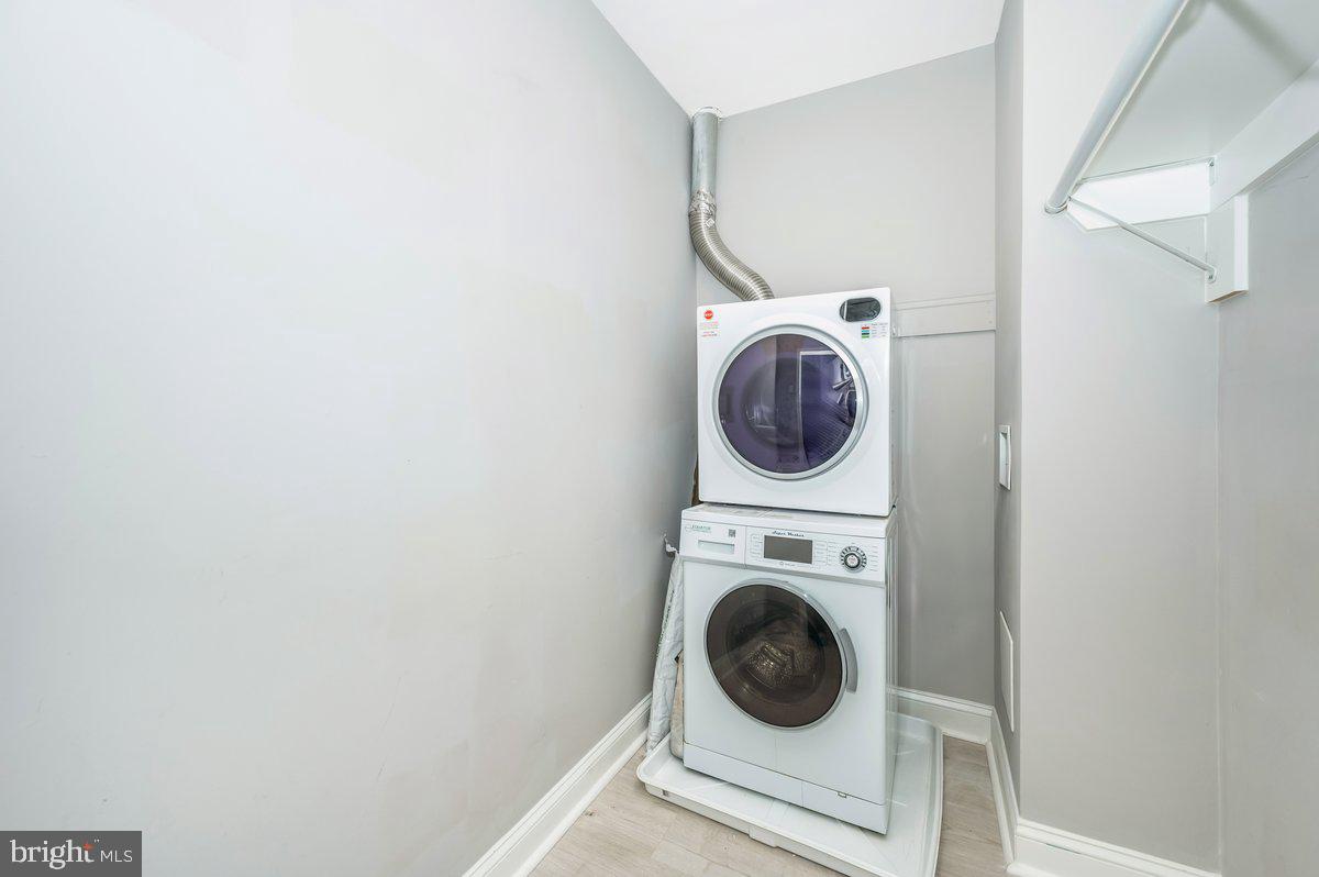 11368 Cherry Hill Road, Unit 1Q204 Beltsville, MD 20705 - Photo 23 of 46 a utility room with dryer and washer