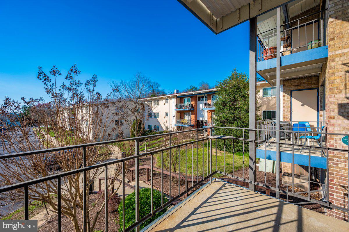 11368 Cherry Hill Road, Unit 1Q204 Beltsville, MD 20705 - Photo 37 of 46 a view of a balcony with chairs