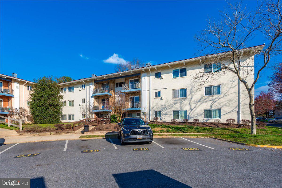 11368 Cherry Hill Road, Unit 1Q204 Beltsville, MD 20705 - Photo 41 of 46 a car parked in front of a white building