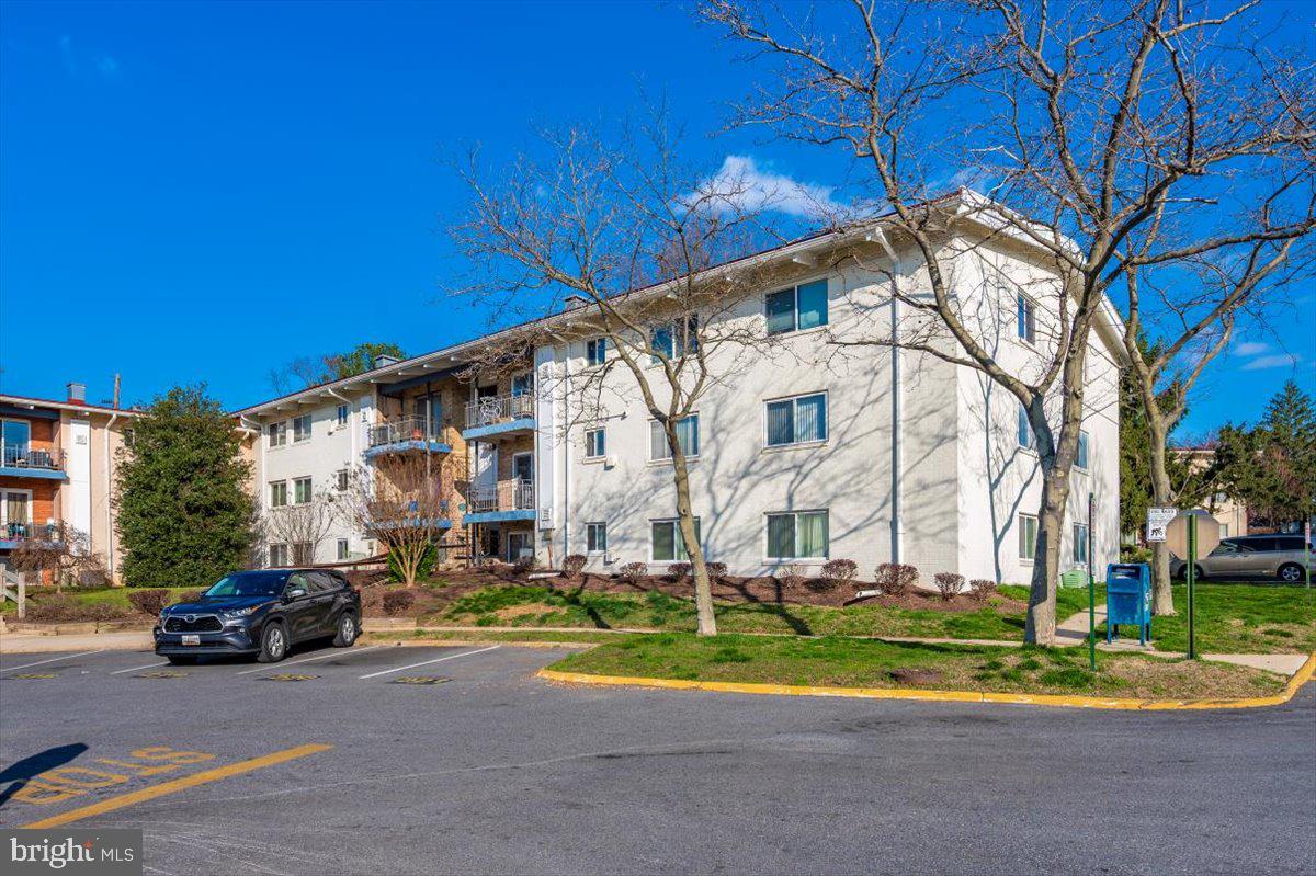 11368 Cherry Hill Road, Unit 1Q204 Beltsville, MD 20705 - Photo 42 of 46 a couple of cars parked in front of a house