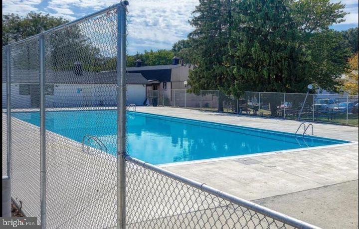 11368 Cherry Hill Road, Unit 1Q204 Beltsville, MD 20705 - Photo 45 of 46 a view of a swimming pool with a patio