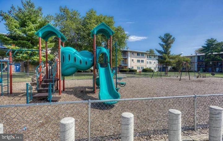 11368 Cherry Hill Road, Unit 1Q204 Beltsville, MD 20705 - Photo 46 of 46 a front view of a house with garden